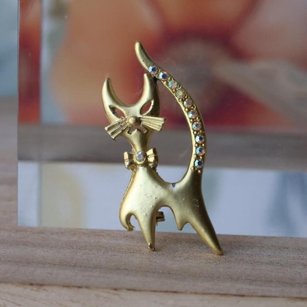 Vintage gold tone cat brooch with iridescent aurora borealis rhinestones